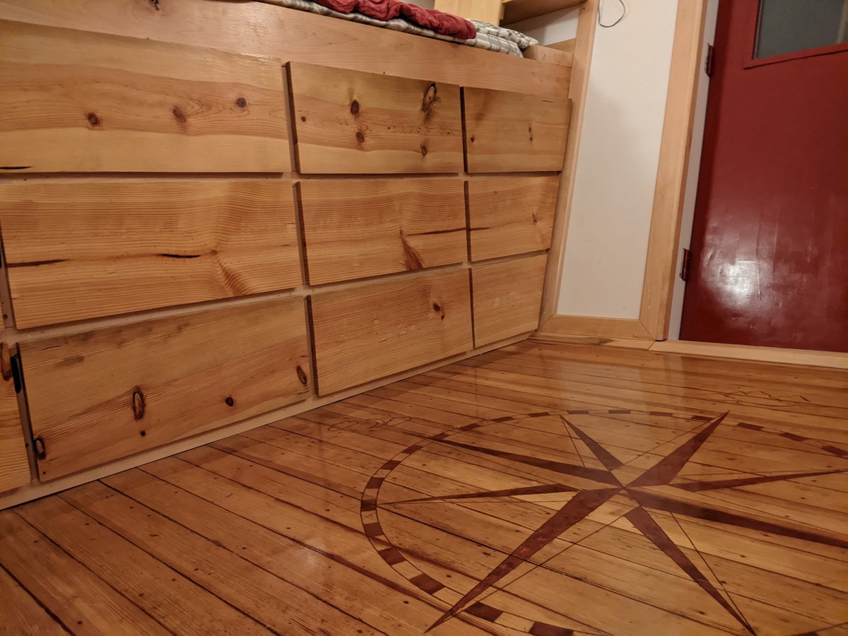 The Starship: wood paneling and a compass rose inlaid in the floor